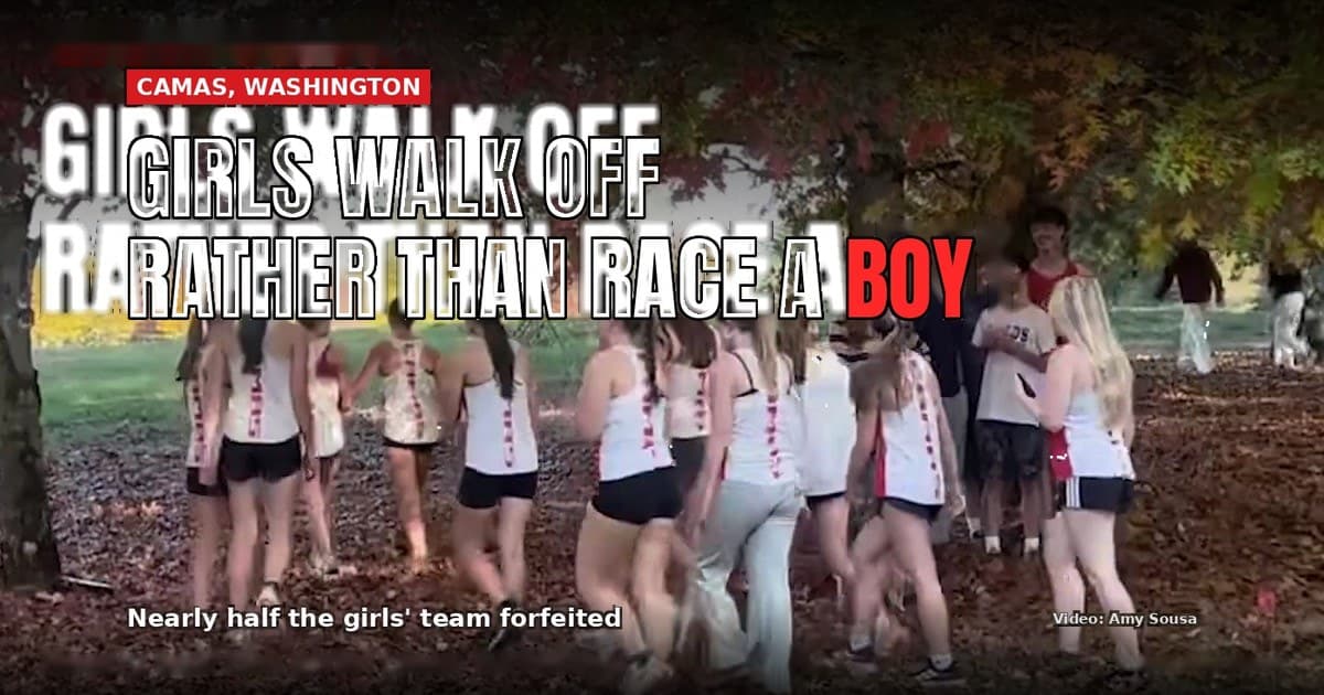Camas High girls' cross-country runners in team uniforms walk together under autumn trees after forfeiting their race