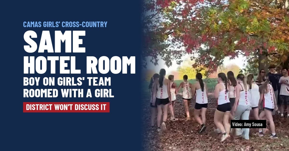 Camas High girls' cross-country runners walk together under autumn trees