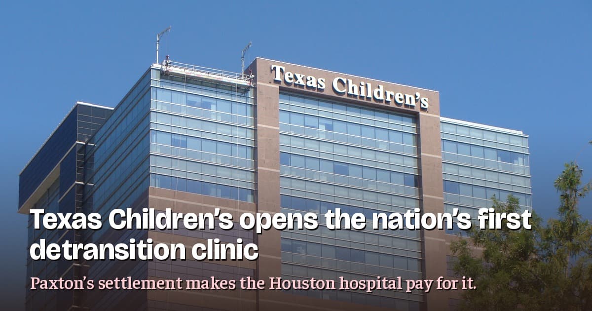 Texas Children's Hospital tower in Houston under a clear blue sky